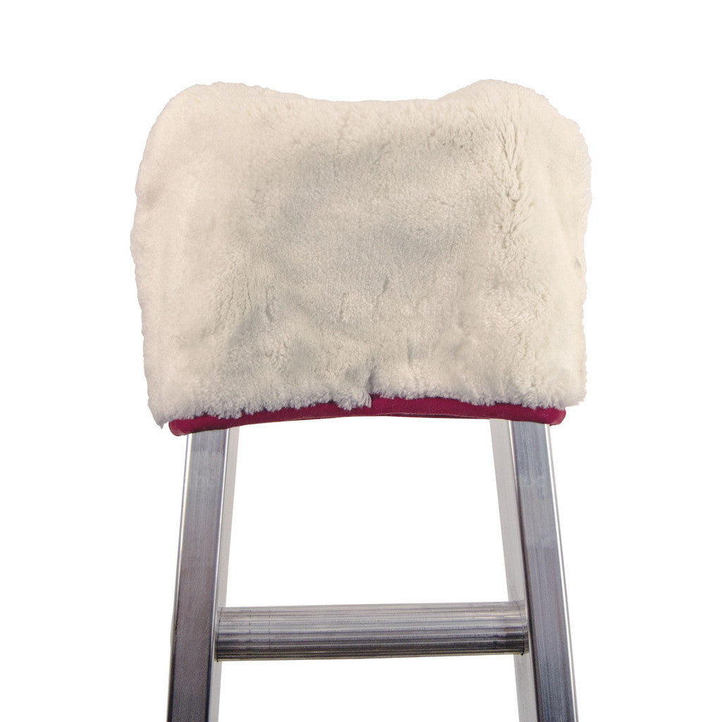 ladder with a white fur cover on a white background