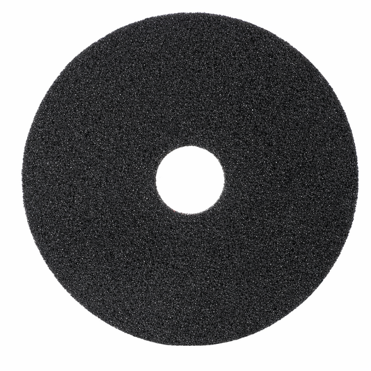 Black foam pad with a central hole on a white background