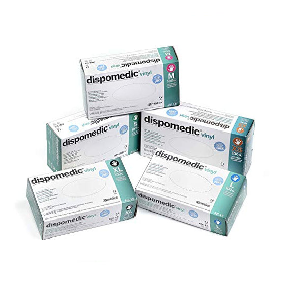 Four boxes of dispomedic vinyl gloves on a white background