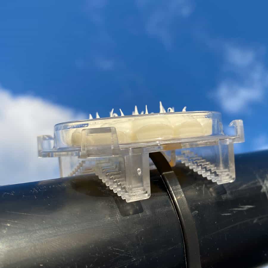 Optical Gel™ Clear plastic with metal components on a blue sky background